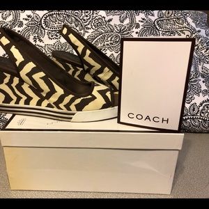 Coach “Sydney” slides in Zebra Print